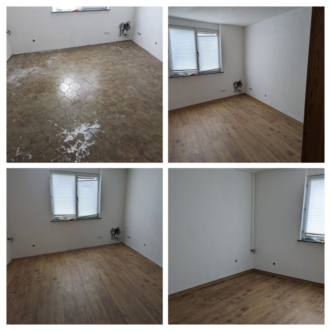 Bodenverlegung Leerer Raum mit Holzfußboden, zwei Fenstern und unrenovierter Ecke.